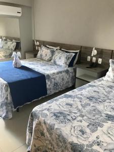 Ένα ή περισσότερα κρεβάτια σε δωμάτιο στο Hotel Ibicui