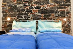 
A bed or beds in a room at B&B dell'Acquario
