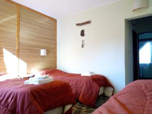 Ein Bett oder Betten in einem Zimmer der Unterkunft Hosteria del Sauquen