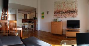 Televízia a/alebo spoločenská miestnosť v ubytovaní Apartment Wenus