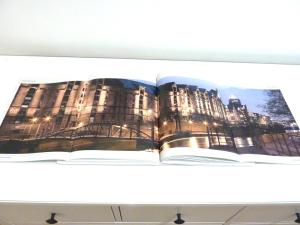 an open book sitting on top of a shelf at All you need - Room in Hamburg