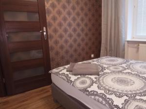 Posteľ alebo postele v izbe v ubytovaní Nordic Apartamenty św.Mikołaja