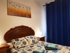 מיטה או מיטות בחדר ב-Aguilon