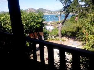 a view of the water from the balcony of a house at 2 bedroom house with bayview, 3 blocks from beach and center of SJ in San Juan del Sur