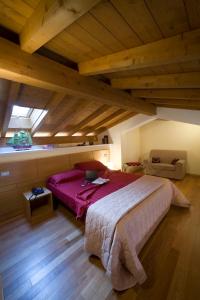 a bedroom with a large bed in a attic at Miramare Resort in Tirrenia