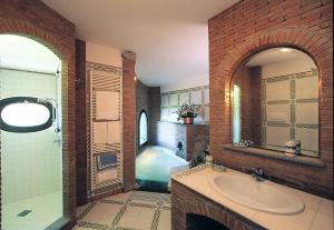 a bathroom with a sink and a bath tub at Hotel La Tonnarella in Sorrento +79 photos