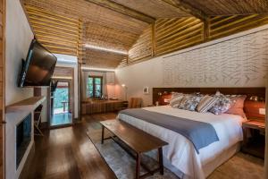 Cama ou camas em um quarto em Pousada Tankamana mais 37 fotos
