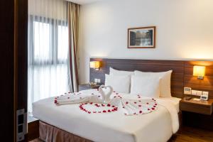 Ένα ή περισσότερα κρεβάτια σε δωμάτιο στο Authentic Hanoi Boutique Hotel
