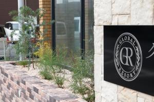 Majutusasutuses Global Resort ONO de LUNE olev sertifikaat, autasu, silt või muu dokument