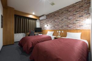 Voodi või voodid majutusasutuse Global Resort ONO de LUNE toas