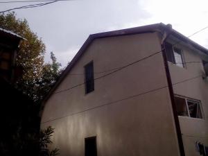 a white building with windows on the side of it at When in Tbilisi in Tbilisi City