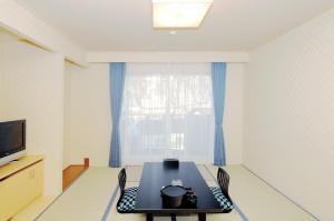 a dining room with a table and a window at Shiretoko Noble Hotel in Shari +72 photos
