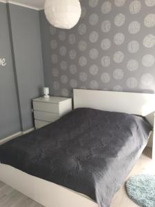 Posteľ alebo postele v izbe v ubytovaní Happy Mammy Bababarát Apartmanház 1 - Hűvös utca