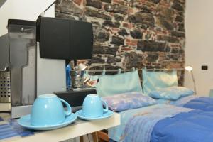 Postel nebo postele na pokoji v ubytování B&B dell'Acquario