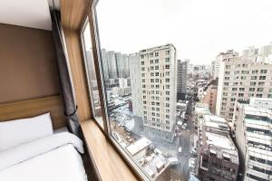 a hotel room with a view of a city at Jongno Hotel Lumia in Seoul