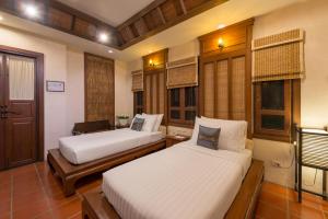 Ліжко або ліжка в номері Horizon Village & Resort SHA Plus