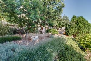 a garden with a statue of a bear in the grass at Apartment Simona in Mali Lošinj +31 photos