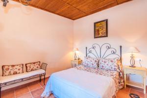 En eller flere senge i et værelse på Cubo's Finca Galiano