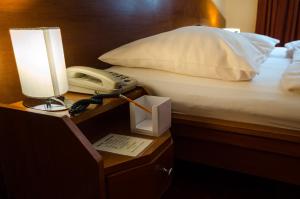 Posteľ alebo postele v izbe v ubytovaní Hotel West
