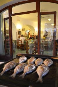 a tray of fish sitting on top of a table at Hotel Europa in Ischia