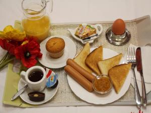 a tray of food with toast and a cup of coffee at Best Season Apart Hotel in Kyiv