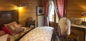 Postel nebo postele na pokoji v ubytování Chalet-Hôtel & Spa Les Cimes