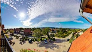 a view of a parking lot with cars parked in it at Hotel Blocksberg in Wernigerode