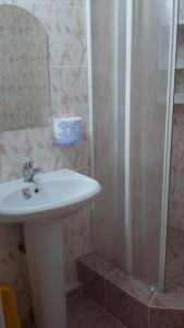 a bathroom with a sink and a shower at Lev in Arkhipo-Osipovka