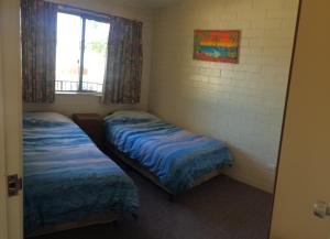 Ένα ή περισσότερα κρεβάτια σε δωμάτιο στο Aquarius Holiday Apartments
