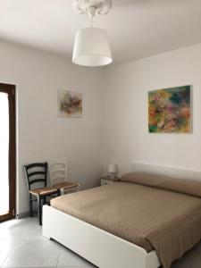 Postel nebo postele na pokoji v ubytování De Nittis' Rooms