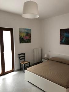 Postel nebo postele na pokoji v ubytování De Nittis' Rooms + 10 fotografií