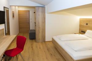 Łóżko lub łóżka w pokoju w obiekcie Hotel Rosner