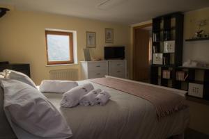 Ein Bett oder Betten in einem Zimmer der Unterkunft Relais Bike "Altaneto22" Spa-Area Relax