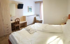 Rúm í herbergi á Hotel Olimpic
