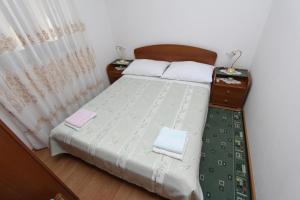 Postel nebo postele na pokoji v ubytování Apartments Milka