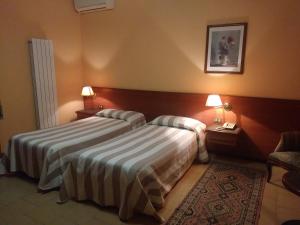 Ein Bett oder Betten in einem Zimmer der Unterkunft Hotel Due Fontane