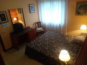 Ein Bett oder Betten in einem Zimmer der Unterkunft Hotel Due Fontane
