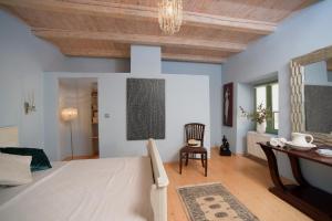 Postel nebo postele na pokoji v ubytování Glavounos House