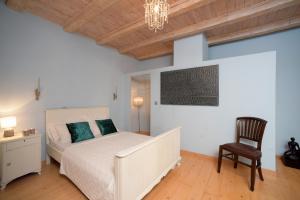 Postel nebo postele na pokoji v ubytování Glavounos House