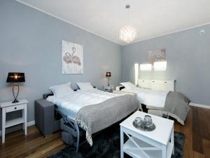 En eller flere senge i et værelse på Gonsiori 7 Lux Apartment