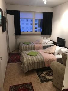 Katil atau katil-katil dalam bilik di Apartment Tampere