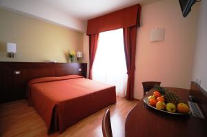 A bed or beds in a room at Hotel Conradi