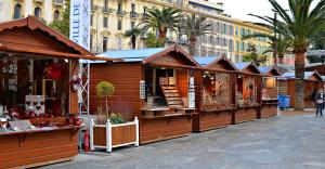 a row of wooden shops in a city street at 2 Bedroom Apartment Old Town Centre in Nice