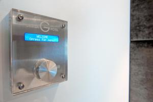 a metal box with a sign that reads logic fires for room at G Design Hotel in Ljubljana