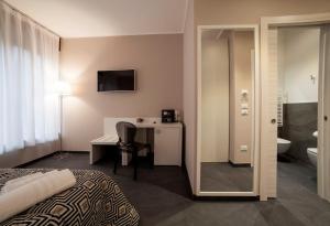 Postel nebo postele na pokoji v ubytování Living Arena