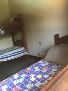 Un pat sau paturi într-o cameră la Casa Praia de Santiago