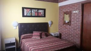 מיטה או מיטות בחדר ב-Hosteria Santa Francisca