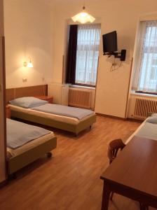 Postel nebo postele na pokoji v ubytování Hotel Pribitzer