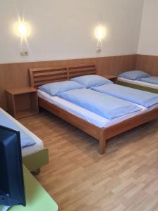 Postel nebo postele na pokoji v ubytování Hotel Pribitzer