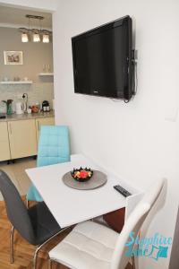 A television and/or entertainment centre at Apartment Sapphire Time